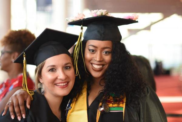 students smiling at 2019 Commencement 
