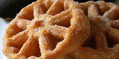 crispy pastry wheel covered in cinnamon sugar