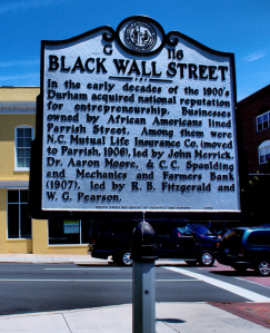 Photo of a historical sign with information about Black Wall Street