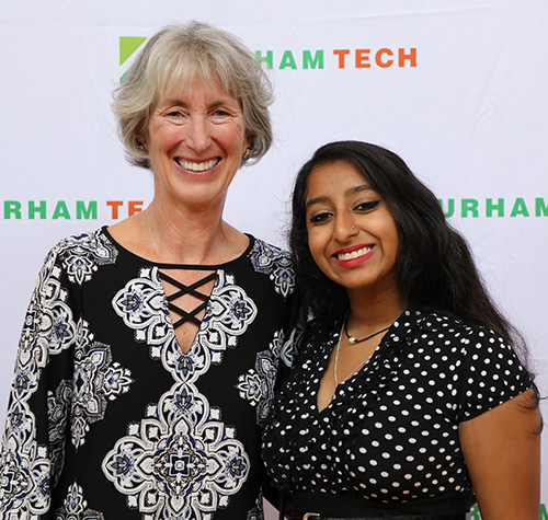 smiling student poses with a scholarship donor