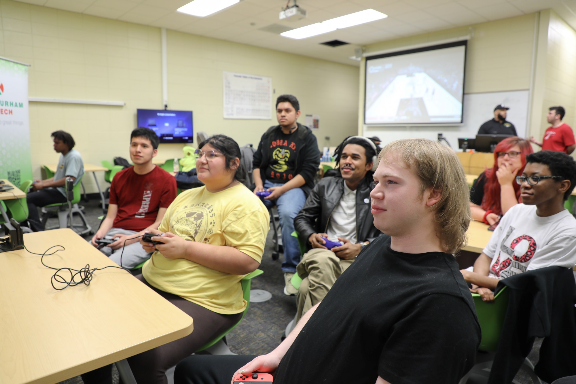 Students in the Gamer's Club gather around to play a video game together