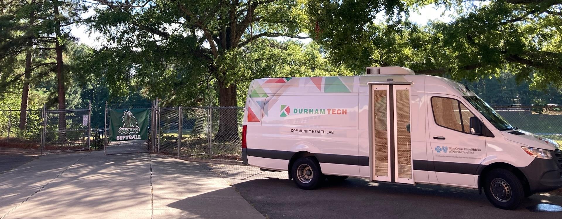 Community Health Lab parked outside a school